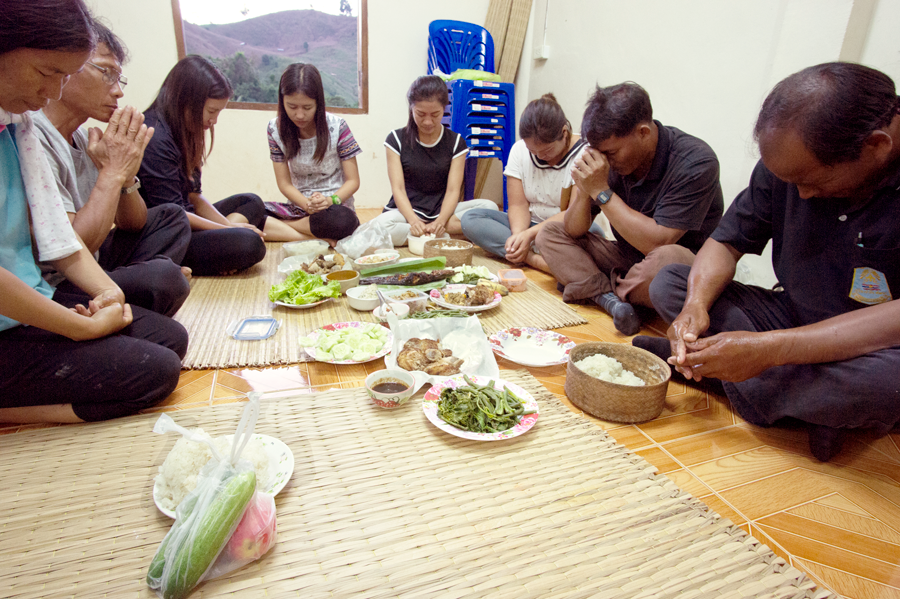 The church planting team shares a meal before teaching in Sandy Creek.