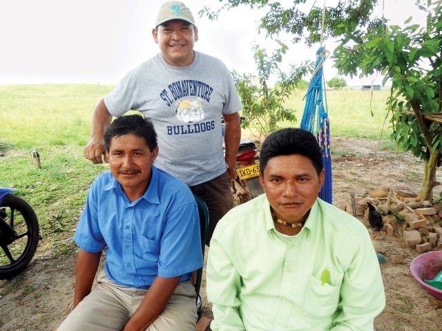 Jhon Jorge (green shirt) on a missionary trip with Cains’ partner, Alberto González