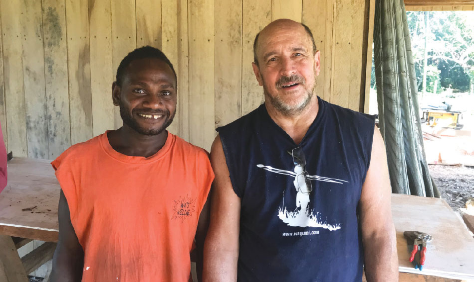 Cleon Watts, right, made new friends when he went from Community Baptist Church to Papua New Guinea to help build a house for Seth and Kaitlyn Sanford