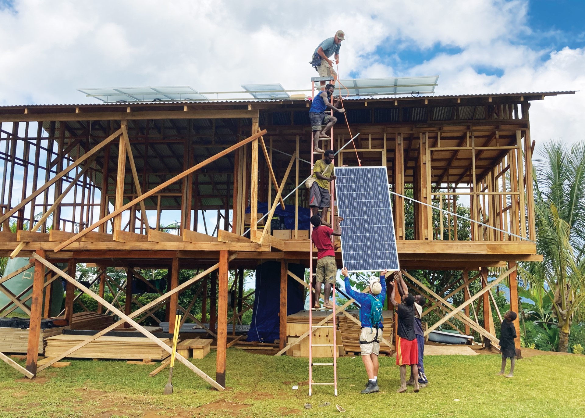 A team installs solar panels on missionary Jonathan Ames’s house in Kuyu, Papua New Guinea.