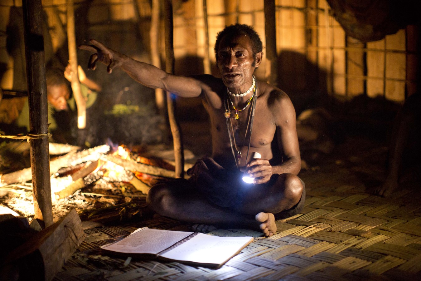 Fato teaching by firelight and flashlight